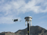 D-RTK 3 station on the survey pole with a Matrice 4 aircraft in flight