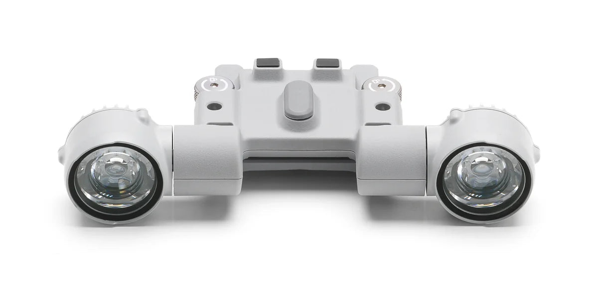 Straight front view of the DJI AL1 Spotlight showing its twin circular lamp lenses